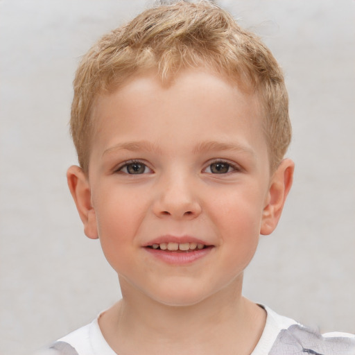 Joyful white child male with short  brown hair and brown eyes