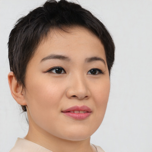 Joyful asian young-adult female with short  brown hair and brown eyes
