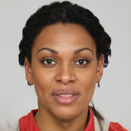 Joyful black adult female with short  brown hair and brown eyes