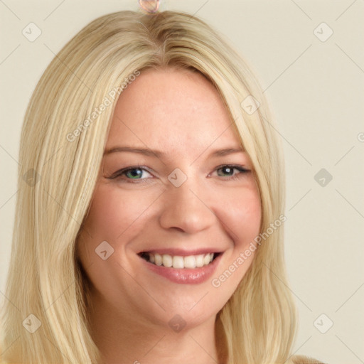 Joyful white young-adult female with long  blond hair and blue eyes