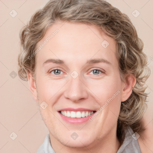 Joyful white young-adult female with medium  brown hair and blue eyes