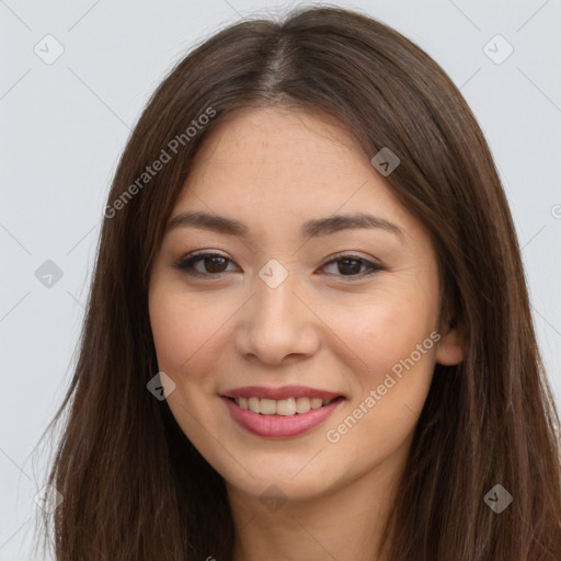 Joyful asian young-adult female with long  brown hair and brown eyes