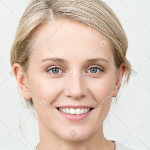 Joyful white young-adult female with medium  brown hair and blue eyes