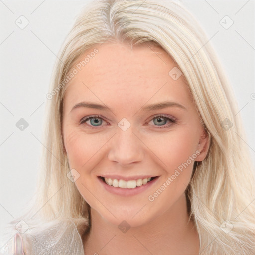 Joyful white young-adult female with long  brown hair and blue eyes