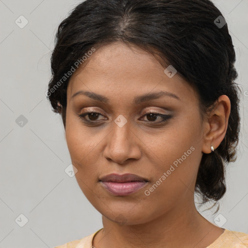 Joyful latino young-adult female with medium  brown hair and brown eyes