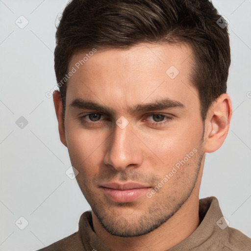 Neutral white young-adult male with short  brown hair and brown eyes