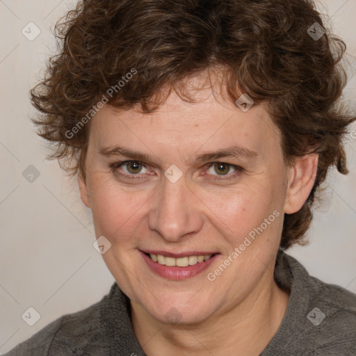 Joyful white adult female with medium  brown hair and blue eyes