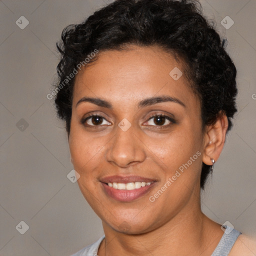 Joyful black young-adult female with short  brown hair and brown eyes