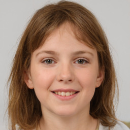 Joyful white child female with medium  brown hair and brown eyes