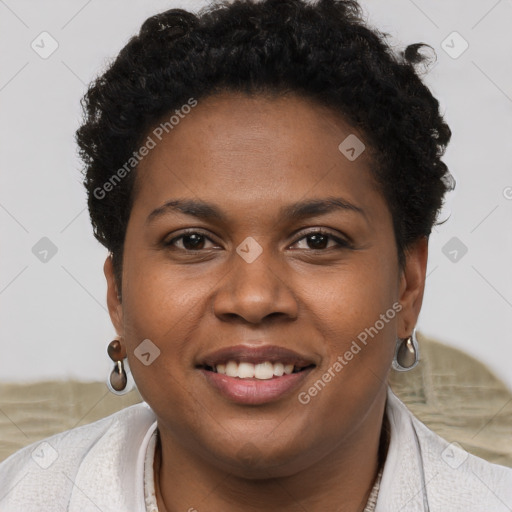 Joyful black young-adult female with short  brown hair and brown eyes