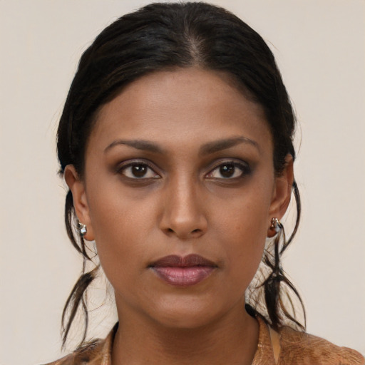 Neutral black young-adult female with short  brown hair and brown eyes
