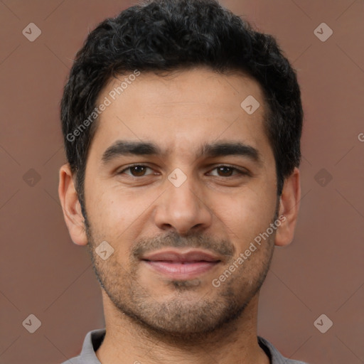 Joyful latino young-adult male with short  black hair and brown eyes