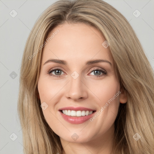 Joyful white young-adult female with long  brown hair and green eyes