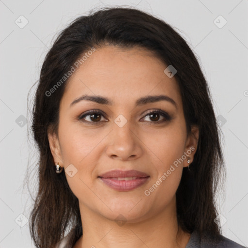 Joyful latino young-adult female with long  brown hair and brown eyes