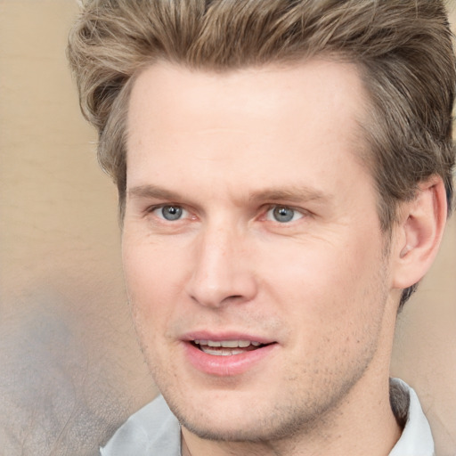 Joyful white adult male with short  brown hair and grey eyes