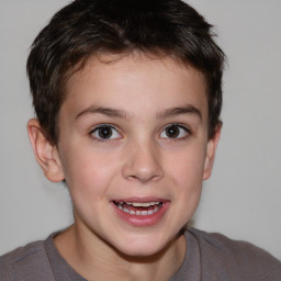 Joyful white child male with short  brown hair and brown eyes