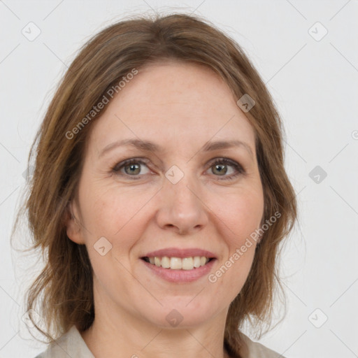 Joyful white adult female with medium  brown hair and grey eyes