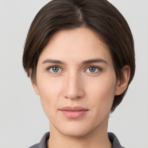 Neutral white young-adult female with short  brown hair and brown eyes