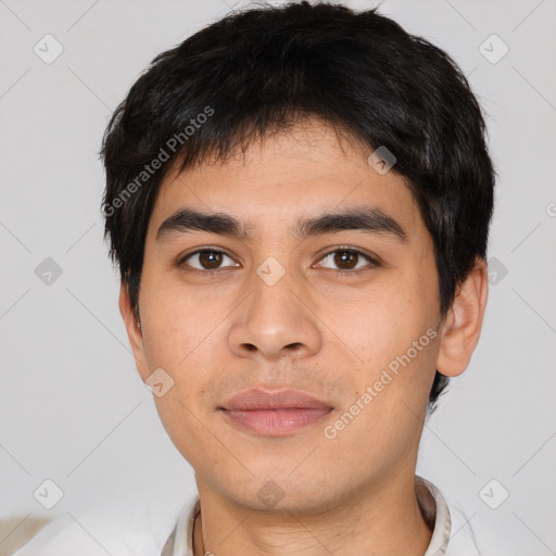 Joyful asian young-adult male with short  black hair and brown eyes