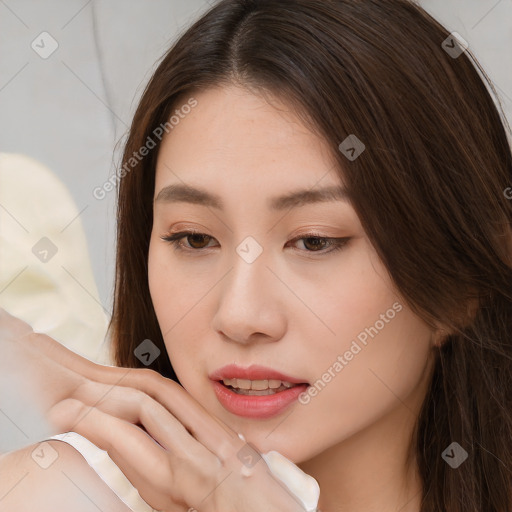 Neutral white young-adult female with long  brown hair and brown eyes