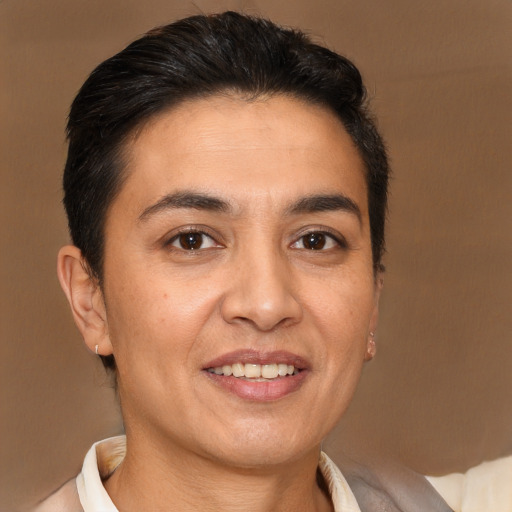 Joyful white adult female with short  brown hair and brown eyes