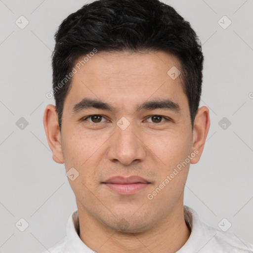 Joyful white young-adult male with short  black hair and brown eyes