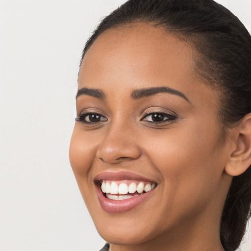 Joyful white young-adult female with long  brown hair and brown eyes