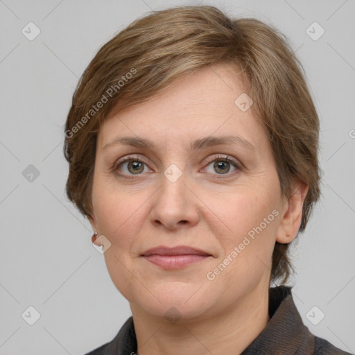 Joyful white adult female with medium  brown hair and grey eyes