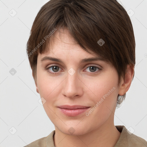 Joyful white young-adult female with short  brown hair and grey eyes