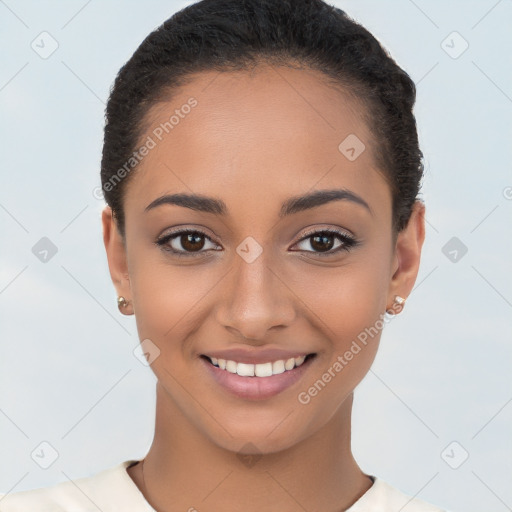 Joyful latino young-adult female with short  brown hair and brown eyes