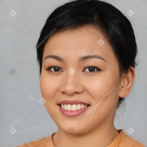 Joyful asian young-adult female with short  brown hair and brown eyes