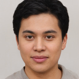 Joyful asian young-adult male with short  black hair and brown eyes