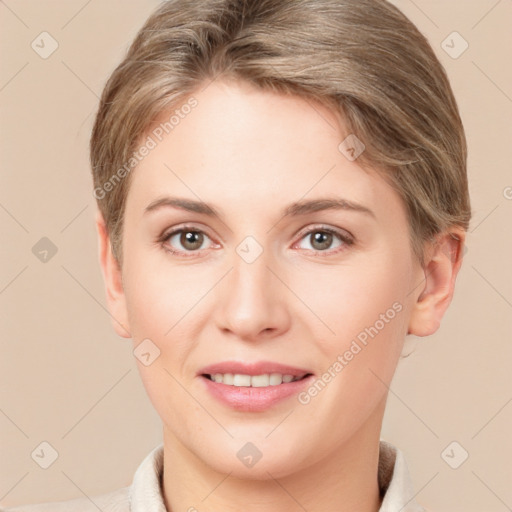 Joyful white young-adult female with short  brown hair and grey eyes