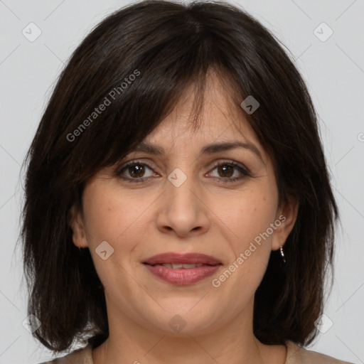 Joyful white adult female with medium  brown hair and brown eyes