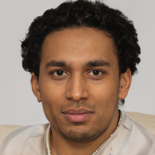 Neutral black young-adult male with short  black hair and brown eyes