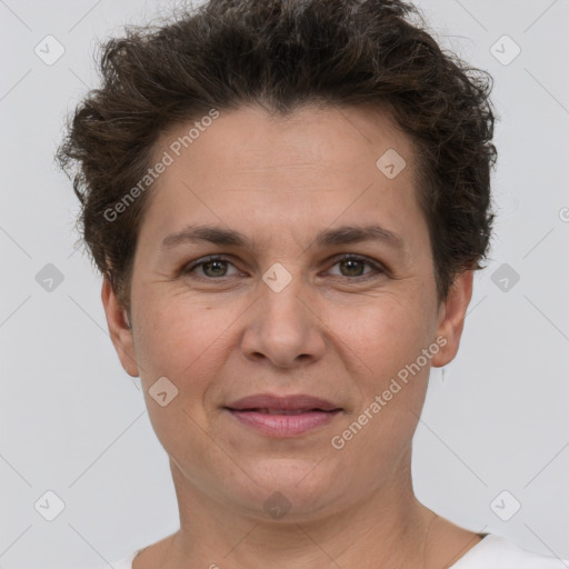 Joyful white adult female with short  brown hair and brown eyes