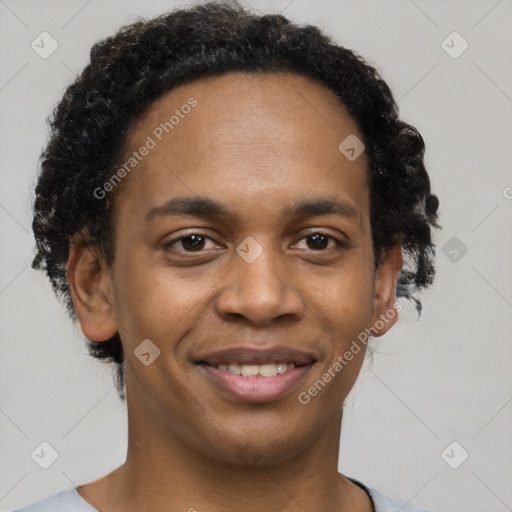 Joyful black young-adult male with short  brown hair and brown eyes