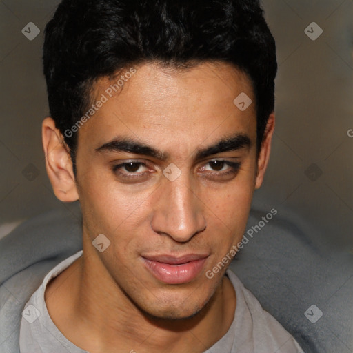 Joyful white young-adult male with short  black hair and brown eyes