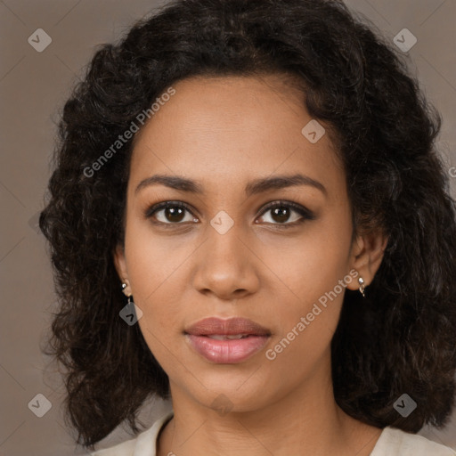 Joyful black young-adult female with medium  brown hair and brown eyes