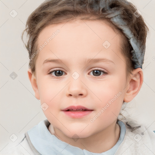 Joyful white child female with short  brown hair and brown eyes