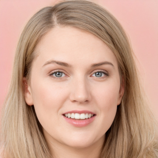 Joyful white young-adult female with long  brown hair and grey eyes