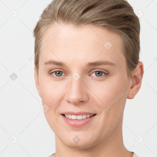 Joyful white young-adult female with short  brown hair and grey eyes