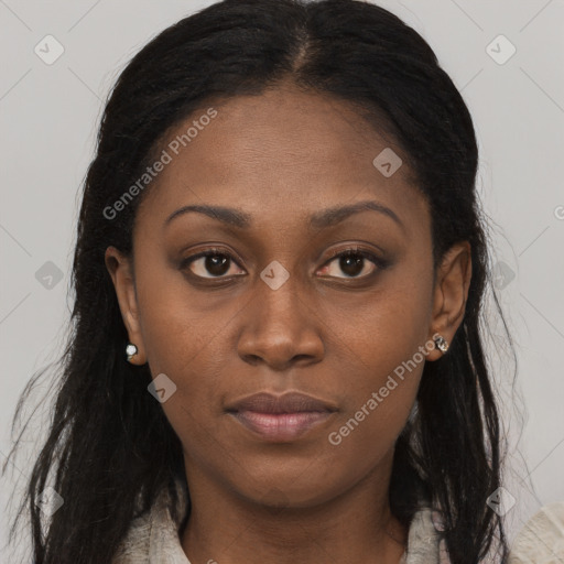 Joyful black young-adult female with long  brown hair and brown eyes