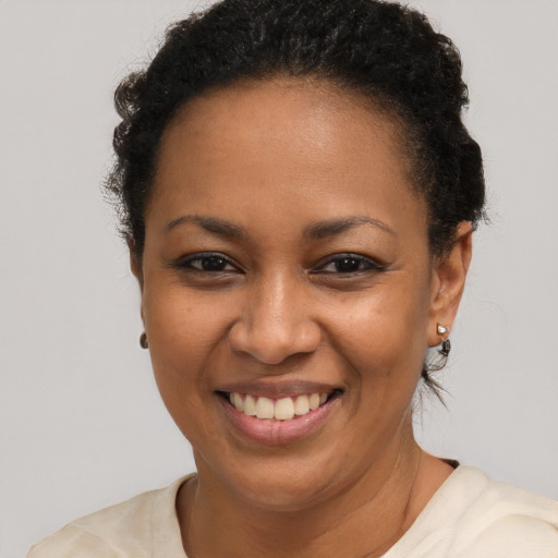 Joyful latino young-adult female with short  brown hair and brown eyes