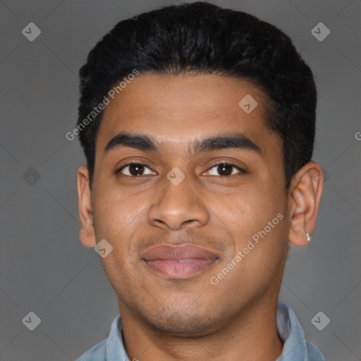 Joyful latino young-adult male with short  black hair and brown eyes