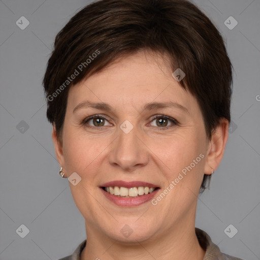 Joyful white adult female with medium  brown hair and grey eyes