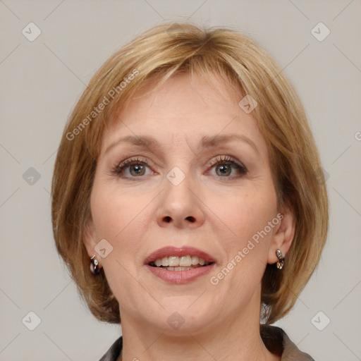 Joyful white adult female with medium  brown hair and blue eyes