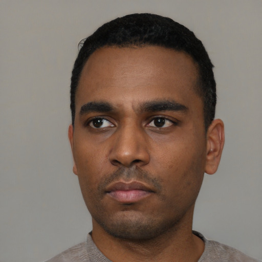 Neutral black young-adult male with short  black hair and brown eyes