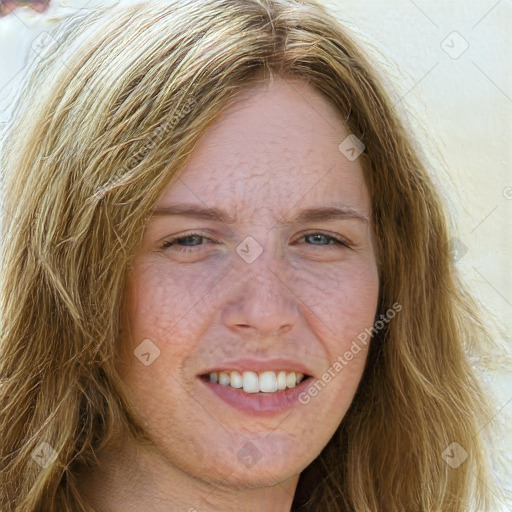 Joyful white adult female with long  brown hair and green eyes