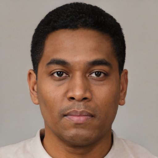 Neutral black young-adult male with short  black hair and brown eyes